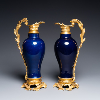 A pair of Chinese monochrome blue vases with gilt bronze ewer mounts, Qianlong and 19th C.