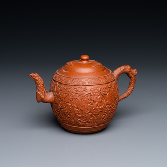 A Chinese Yixing stoneware teapot with boys among peony scrolls, Kangxi