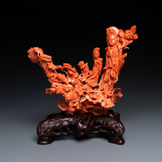 A large Chinese carved red coral group with two ladies surrounded by birds, fish and flowers, 19th C.