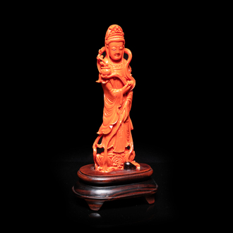 A Chinese carved red coral 'Guanyin' figure, 19/20th C.