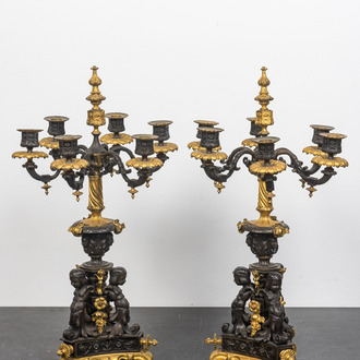 A pair of French partly gilt bronze 'atlants' candelabra, 19th C.