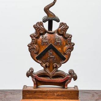 A partly polychromed wooden coat of arms with three stags, 18/19th C.