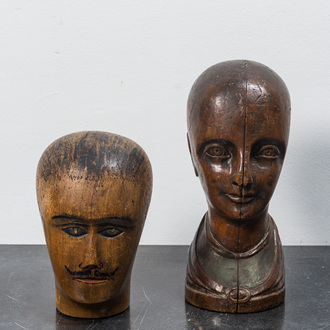 Two wooden head-shaped hat-shape models, 19th C.