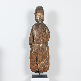 A Romanesque wooden figure of an apostle with traces of polychromy, probably Flanders, 14th C.