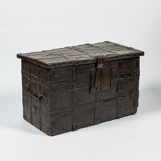 A wrought iron-mounted wooden coffer with leather upholstery, 17th C.