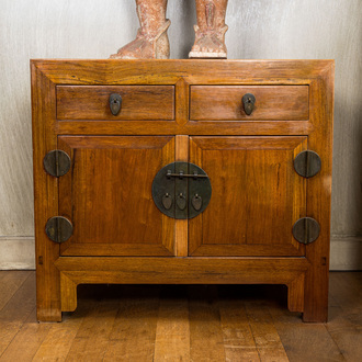 A Chinese two-door cabinet with two drawers, 20th C.