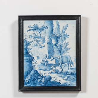 A fine blue and white 'pastoral subject' stove tile mounted as a plaque, France, 18/19th C.