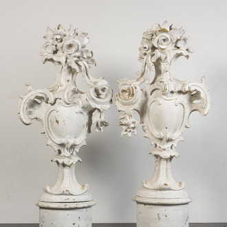 A pair of large white patinated wooden ornaments with a shield and flowers, 18th C