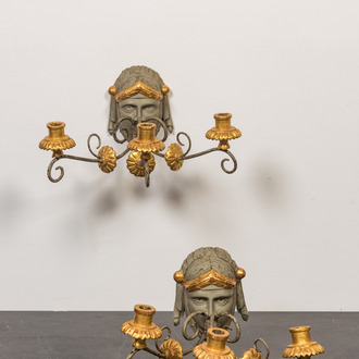 A pair of partly gilt and painted wooden wall appliques, 19th C.