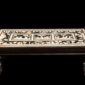 An Italian black and white scagliola table with hunting scenes, probably 18th C.
