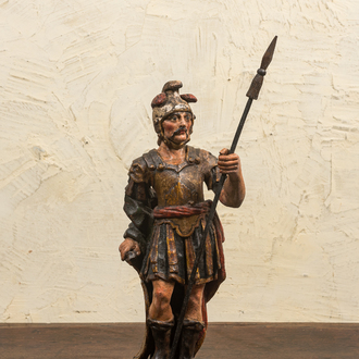A polychrome wooden sculpture of a Roman soldier, 17/18th C.