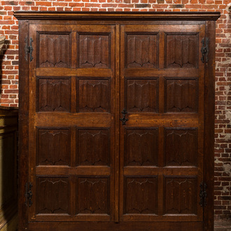A Flemish Gothic oak two-door cabinet with linenfold panels, 19th C. with older elements