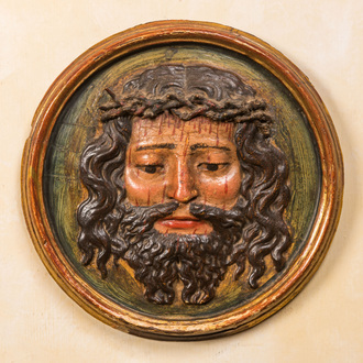 A polychrome wooden 'Christ with the crown of thorns' medallion, probably 17th C.