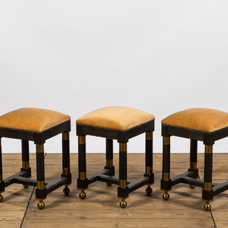 Three square black painted brass mounted wooden stools, 20th C.
