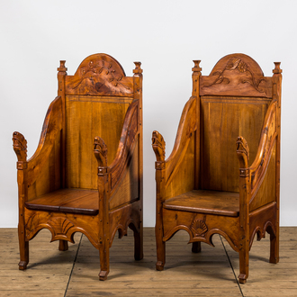 A pair of English carved wooden 'Arts and Crafts'-style chairs, 20th C.