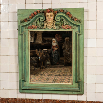 A rectangular polychrome wooden neoclassical mirror with central mascaron, 19th C.