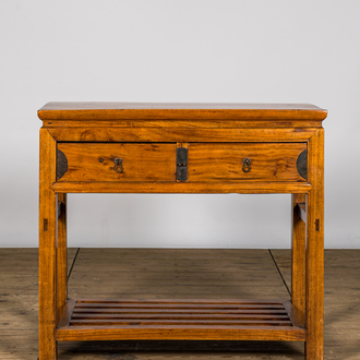 A Chinese wooden console with two drawers, 20th C.