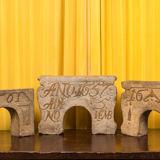 Three dated stone arch-shaped architectural elements, 17th C.