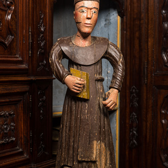 A polychrome wooden sculpture of a monk, 17/18th C.