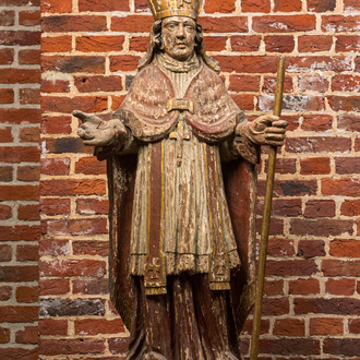 A polychrome wooden bishop with staff, 17/18th C.