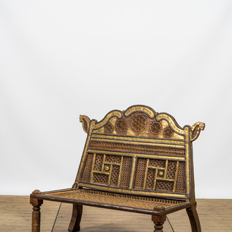 A colonial-inspired brass mounted wooden bench, 20th C.