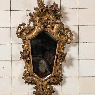A French finely carved gilt wooden Louis XV-style rocaille mirror with roses, 18/19th C.
