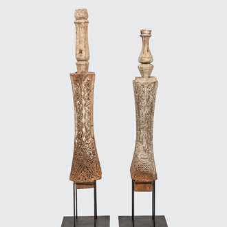 A pair of Indian wooden ornaments on a metal base, 19th C.
