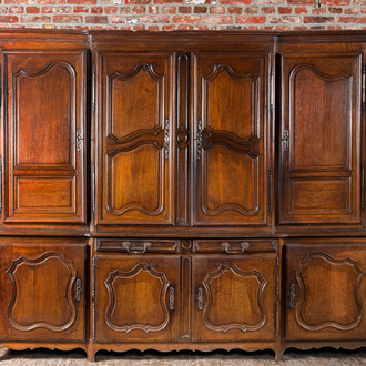 A large French oak two-part cupboard with eight doors and two drawers, Lorraine region, 18th C.