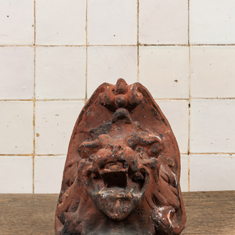 A patinated terracotta ornament with a lion's head, 19th C.
