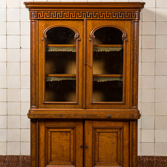 An oak display cabinet with meander decoration, ca. 1900
