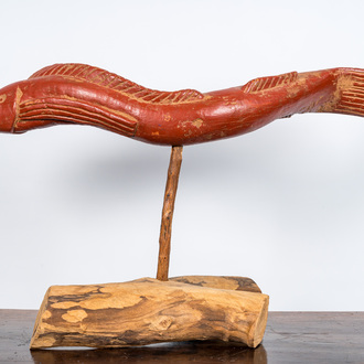 A polychromed wooden eel on foot, 20th C.
