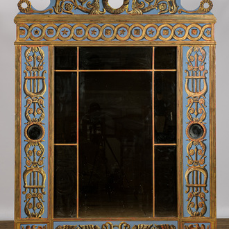 An imposing richly decorated polychrome wooden mirror, 20th C.