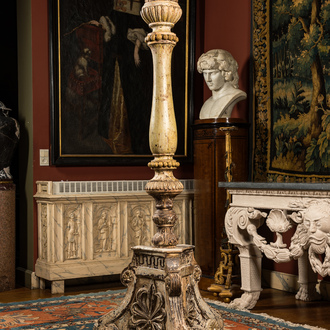 A massive Italian patinated wooden candlestick, 18/19th C.