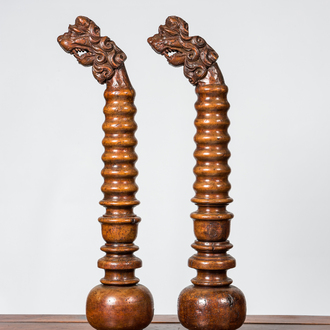 A pair of Italian baluster-shaped elements topped with lions' heads, 17/18th C. and later