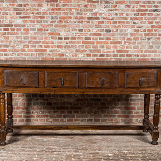 A four-drawer southern European walnut table, 18th C. and later