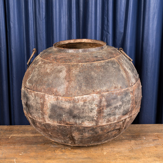 A spherical cauldron consisting of several iron plates, 19/20th C.