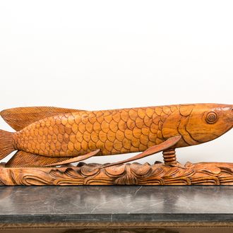 A large Indonesian wood sculpture of a fish, 1st half 20th C.