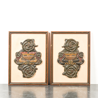 A pair of decorative framed polychromed wooden ornaments from a church bench, probably Friesland, The Netherlands, 18th C.