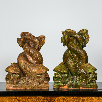 A pair of large Italian glazed terracotta sculptures of entwined dolphins, 20th C.
