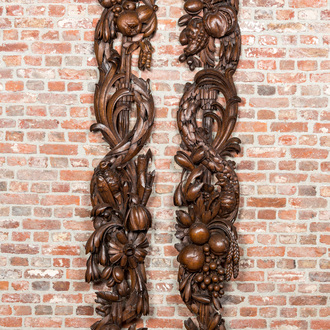A pair of large carved oak reliefs with birds among fruit and flower scraps, 18th C.