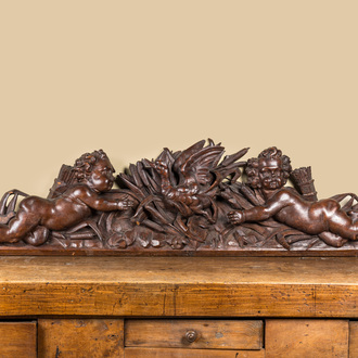 A carved oak fronton with two angels around a central duck, late 18th C.