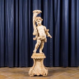 A large white patinated wooden putto holding a cornucopia, 18th C.