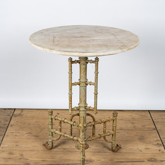 A cast iron tripod side table with marble top, 20th C.