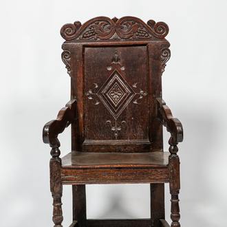 An English walnut and oak wooden armchair, 18th C.