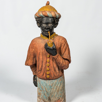 A French polychrome terracotta fireplace in the shape of a pipe smoking Moor, ca. 1900