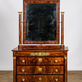 A French Empire-style mahogany veneered chest of drawers with mirror, 19th C.