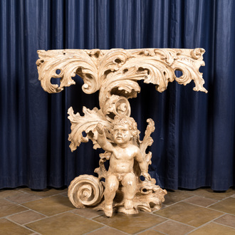 An Italian patinated wooden console with a putto below foliage, 19th C.