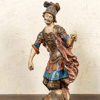 A polychrome and gilt wooden figure of a Roman soldier, 18th C.