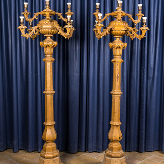 A pair of large patinated wooden and cast iron nine-light candelabra, ca. 1900
