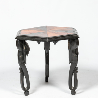 An hexagonal African colonial parquetry side table on elephant legs, 20th C.